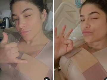 Priscila Fantin faz sinal de positivo em cama de hospital